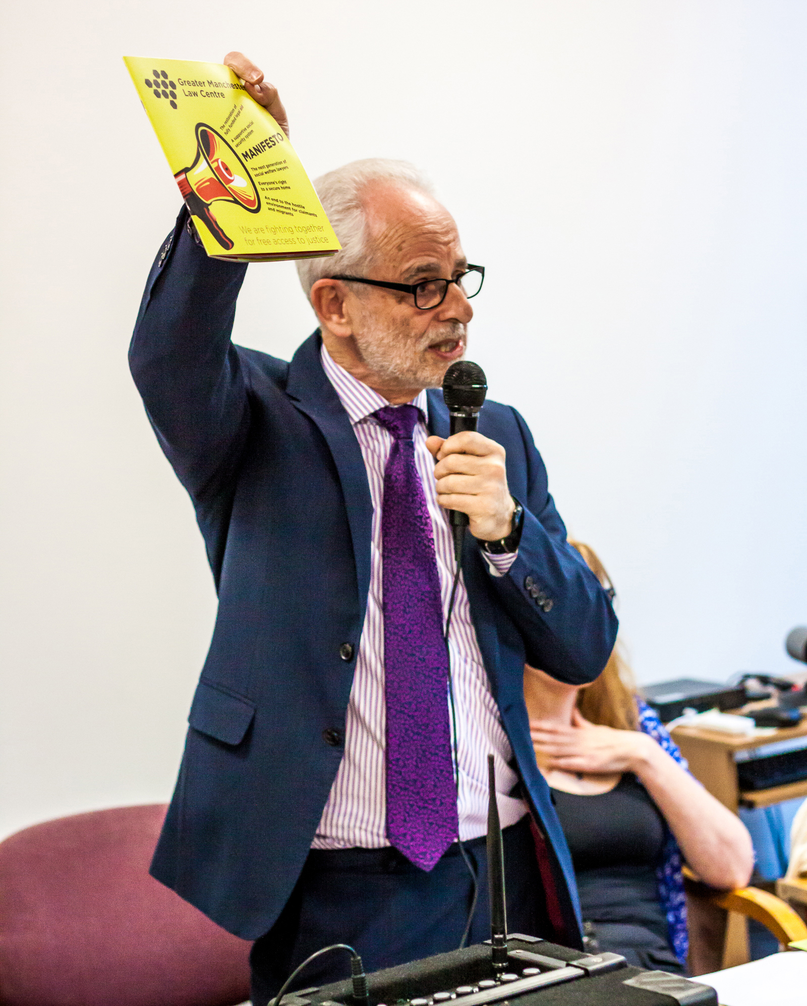 Robert Lizar holding up Manifesto brochure